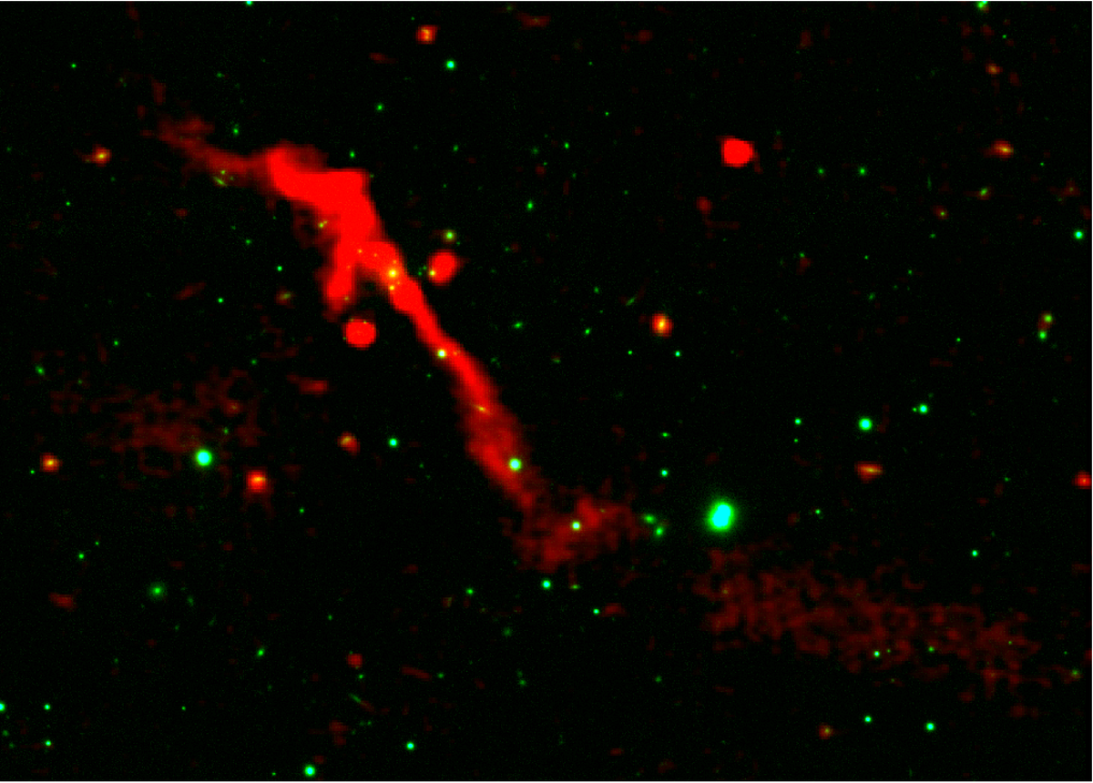 Radio and optical composite image of galaxy J1007+3540 showing asymmetric plasma lobes from a restarted supermassive black hole