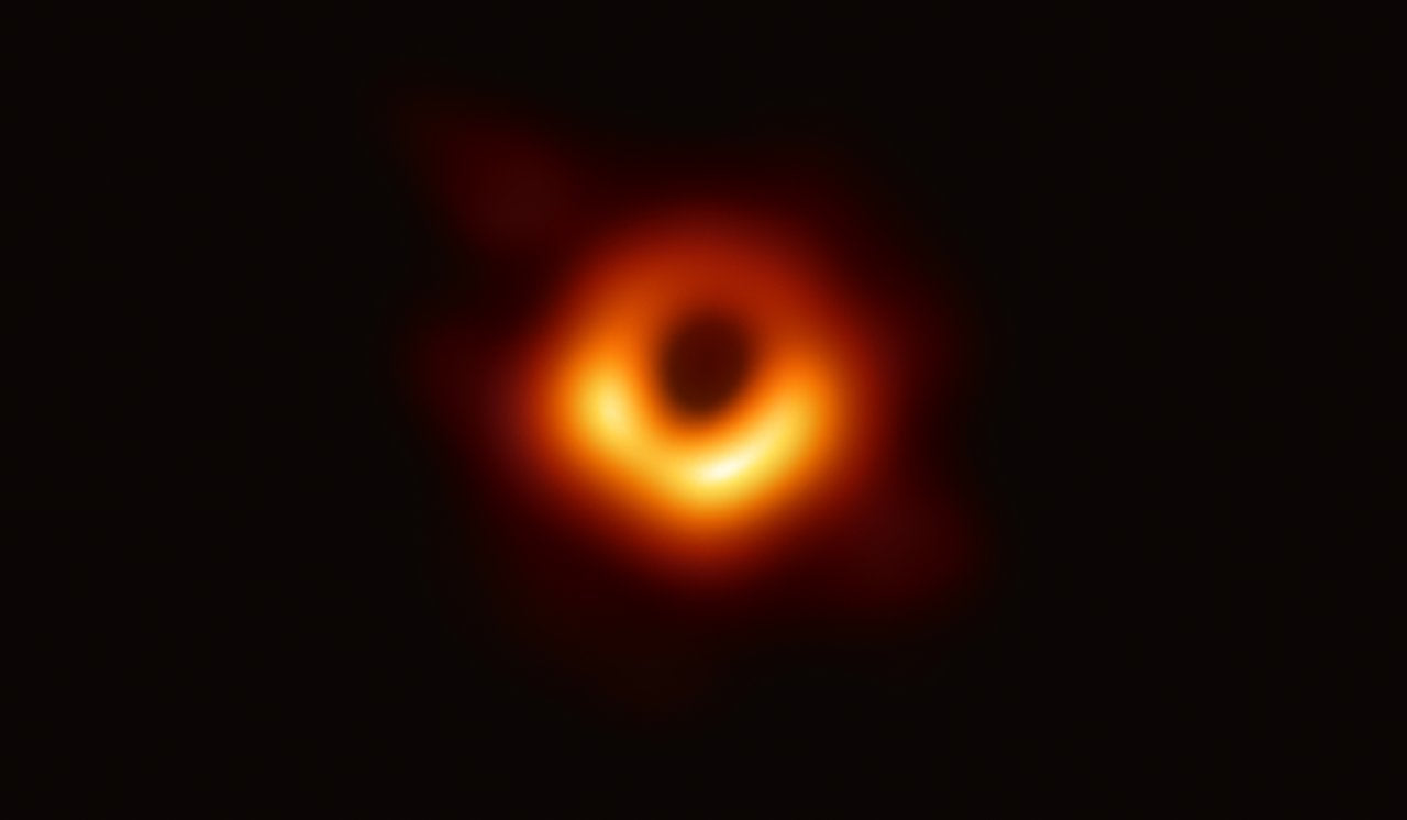 First image of a black hole, captured by the Event Horizon Telescope in 2019, showing the glowing orange ring of superheated gas around the dark shadow of M87 star